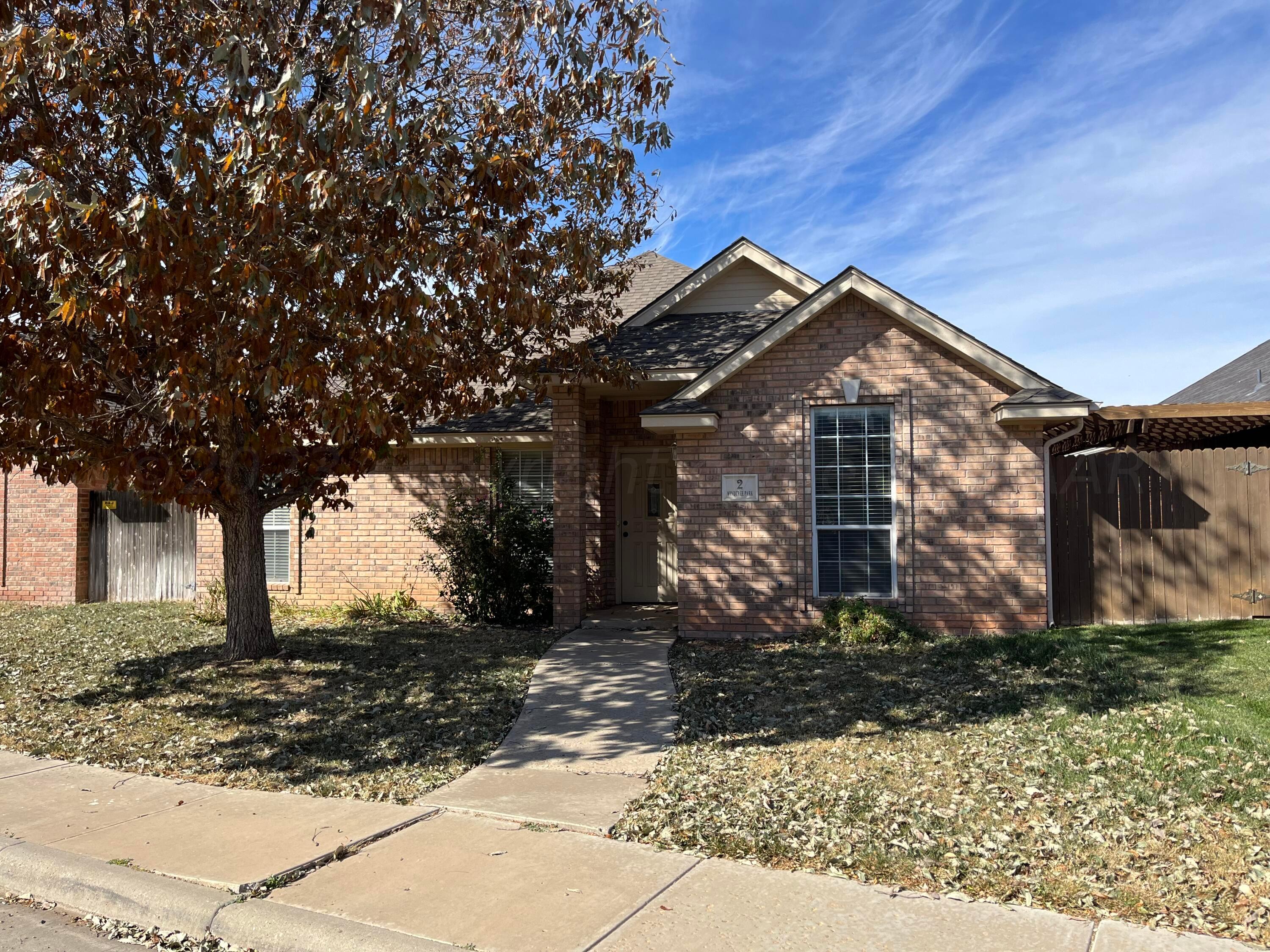 2 Windtree Amarillo, TX 79121 - Photo 1 of 15 a front view of a house with a yard