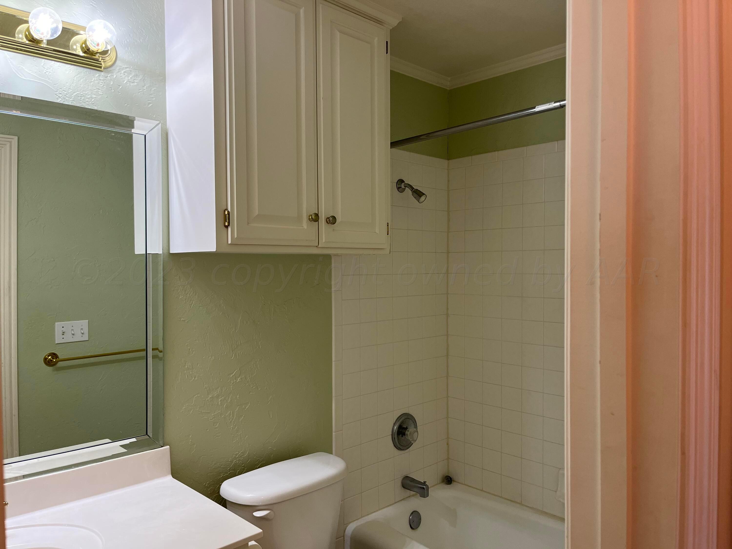 2 Windtree Amarillo, TX 79121 - Photo 13 of 15 a bathroom with a sink and a toilet