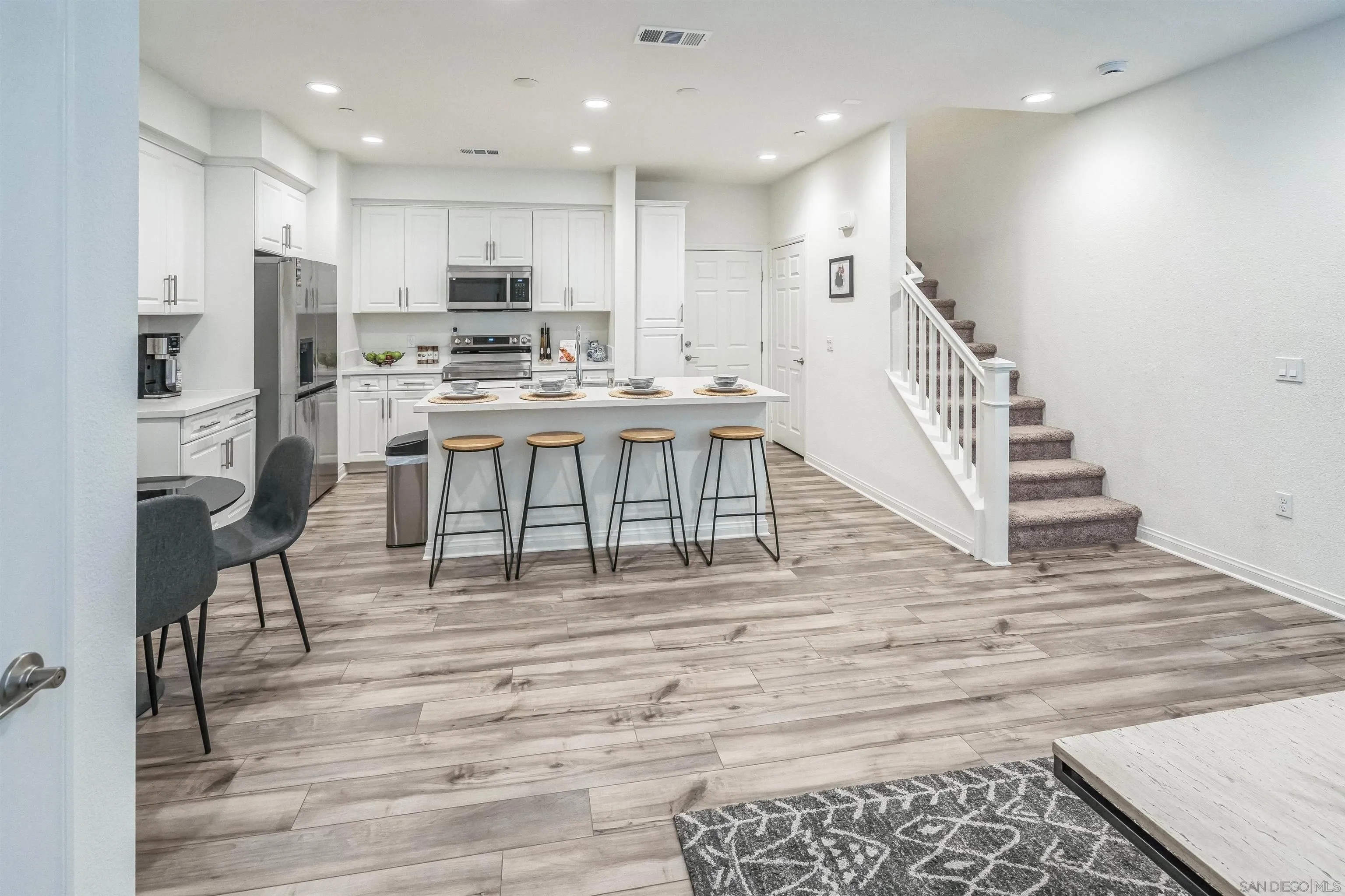 2018 Barite Street Spring Valley, CA 91977 - Photo 7 of 47 a view of kitchen with cabinets microwave and stove