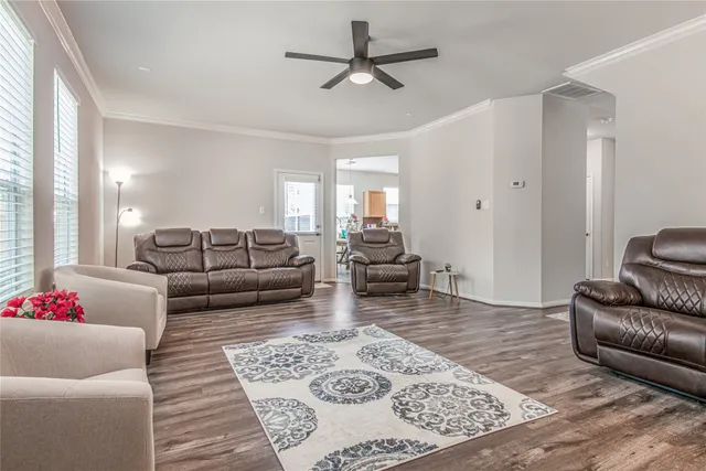 a living room with furniture and a rug