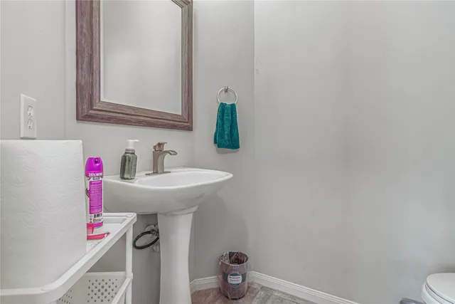 a front view of a house with cars