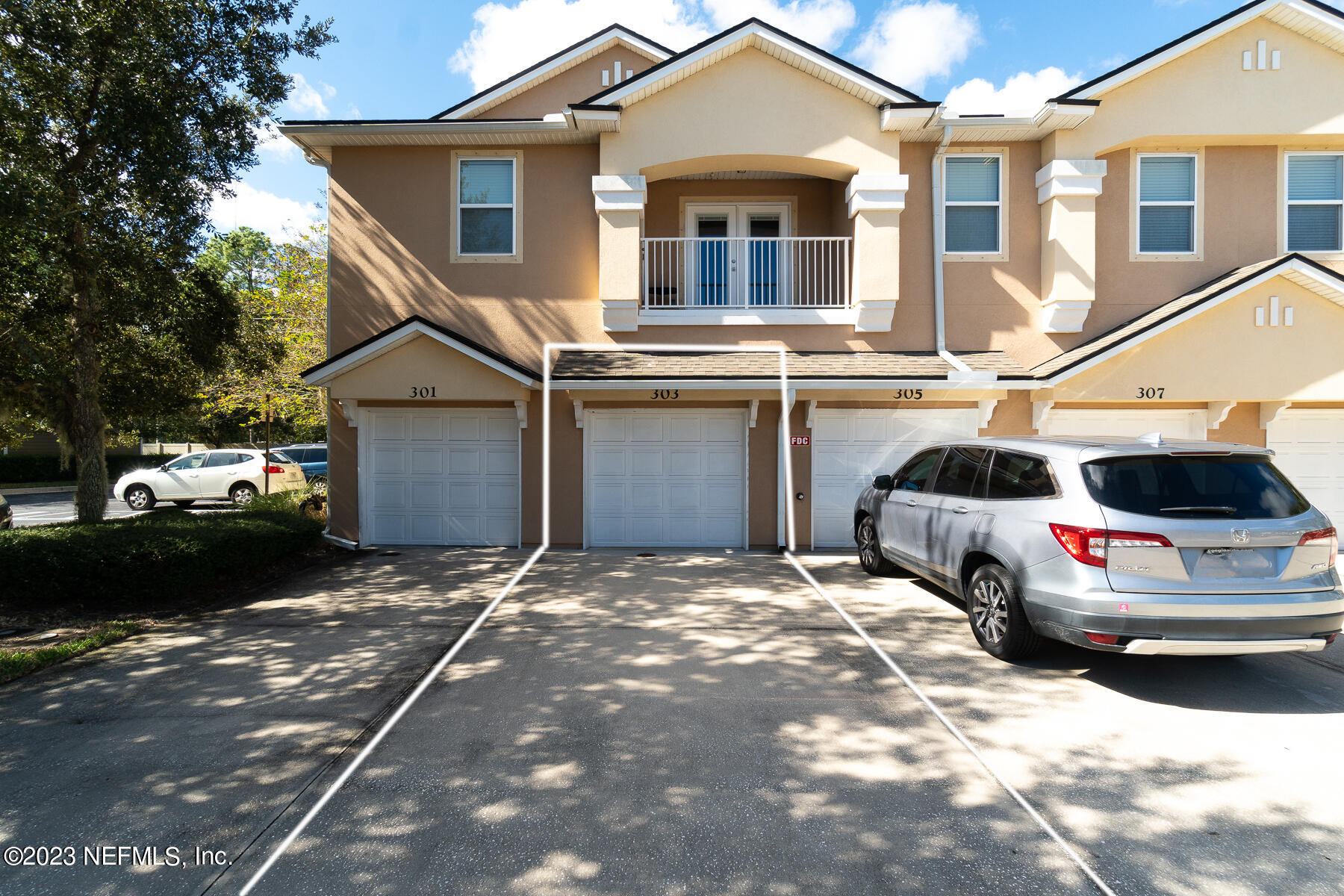 303 Golden Lake Loop St. Augustine, FL 32084 - Photo 1 of 38 a view of a car park in front of a house