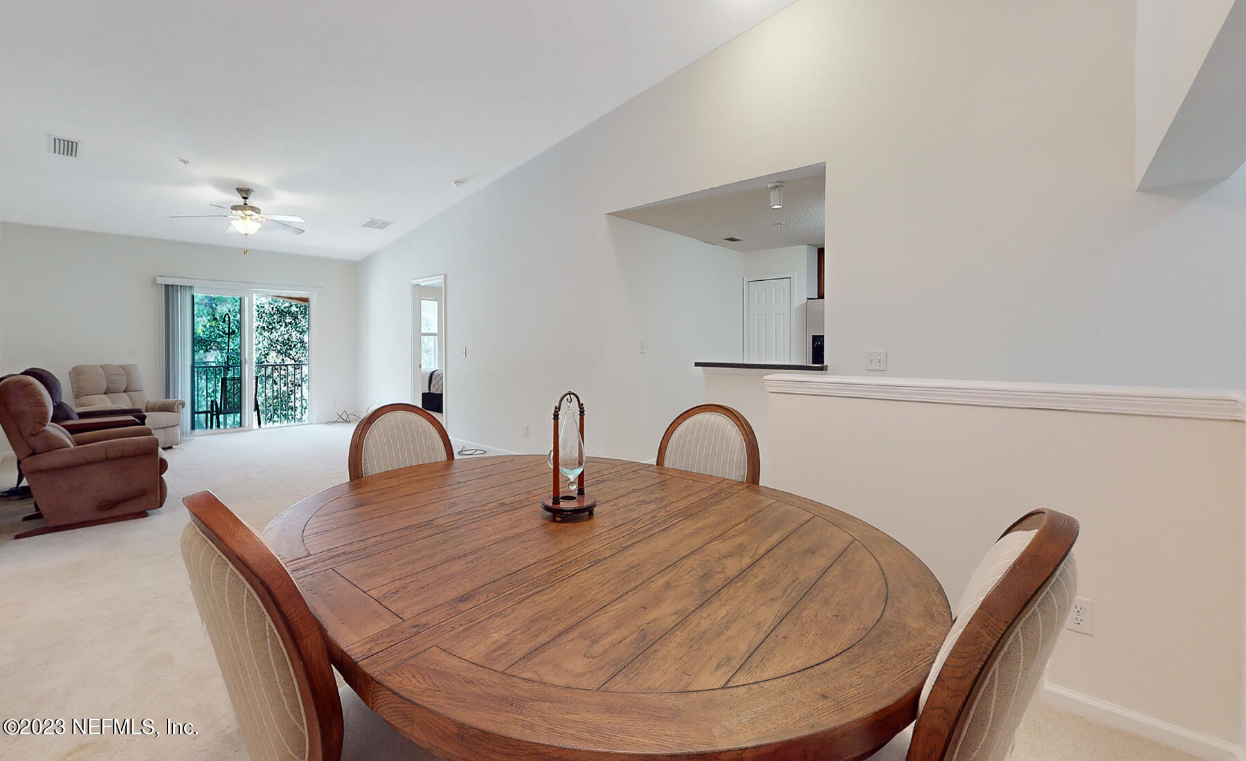 303 Golden Lake Loop St. Augustine, FL 32084 - Photo 13 of 38 a view of a dining room with a table and chairs