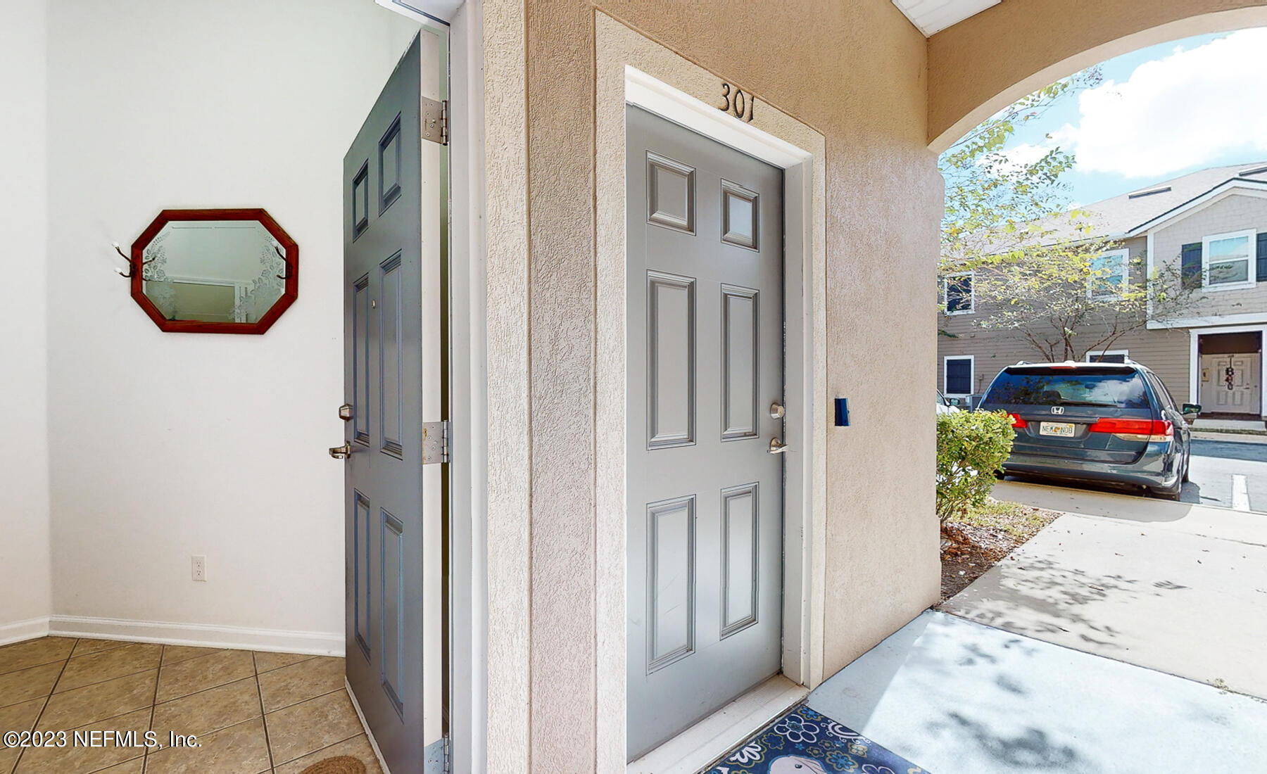 303 Golden Lake Loop St. Augustine, FL 32084 - Photo 14 of 38 a view of a livingroom with furniture and cars