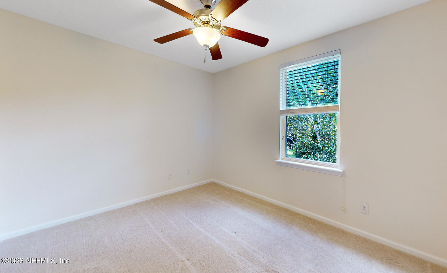 303 Golden Lake Loop St. Augustine, FL 32084 - Photo 21 of 38 an empty room with a window and a fan