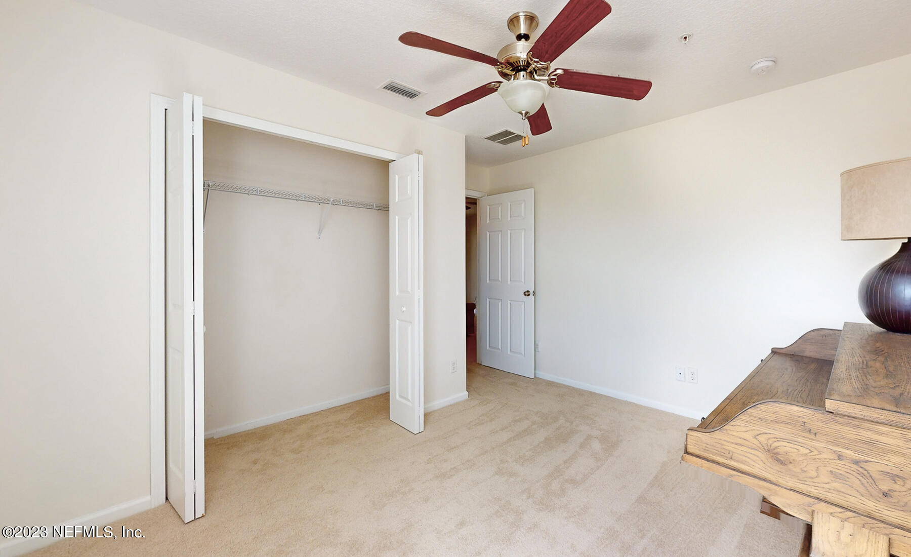 303 Golden Lake Loop St. Augustine, FL 32084 - Photo 23 of 38 a view of a hallway with a chandelier fan