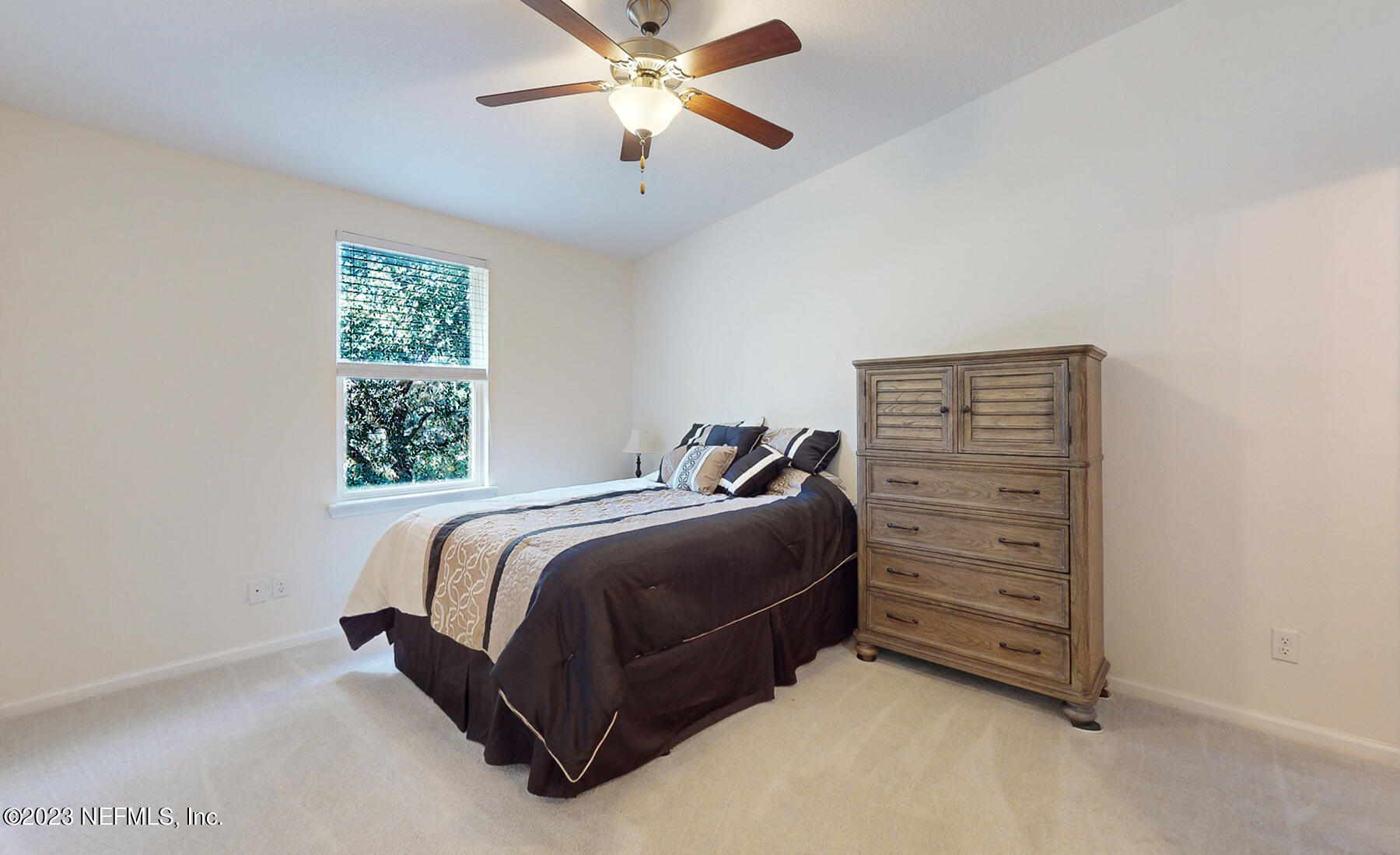 303 Golden Lake Loop St. Augustine, FL 32084 - Photo 7 of 38 a bedroom with a bed and a window