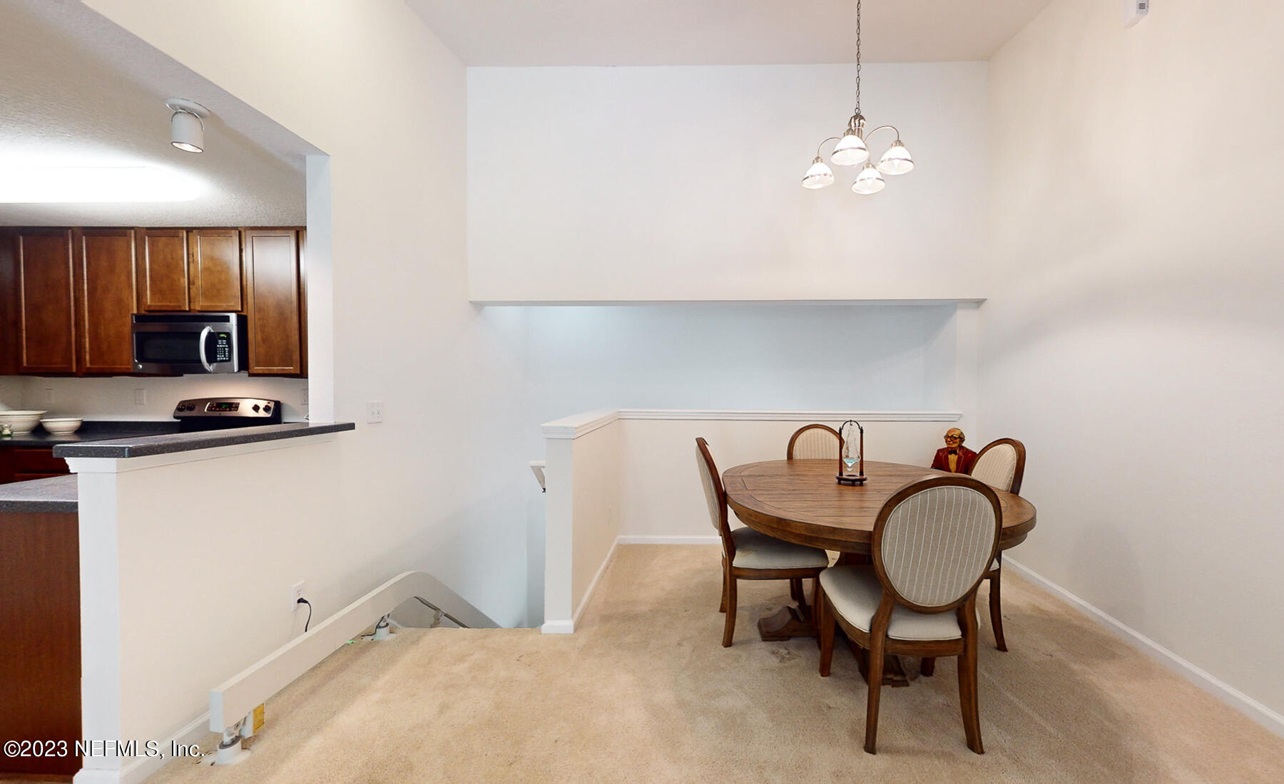 303 Golden Lake Loop St. Augustine, FL 32084 - Photo 10 of 38 a dining room with furniture and chandelier