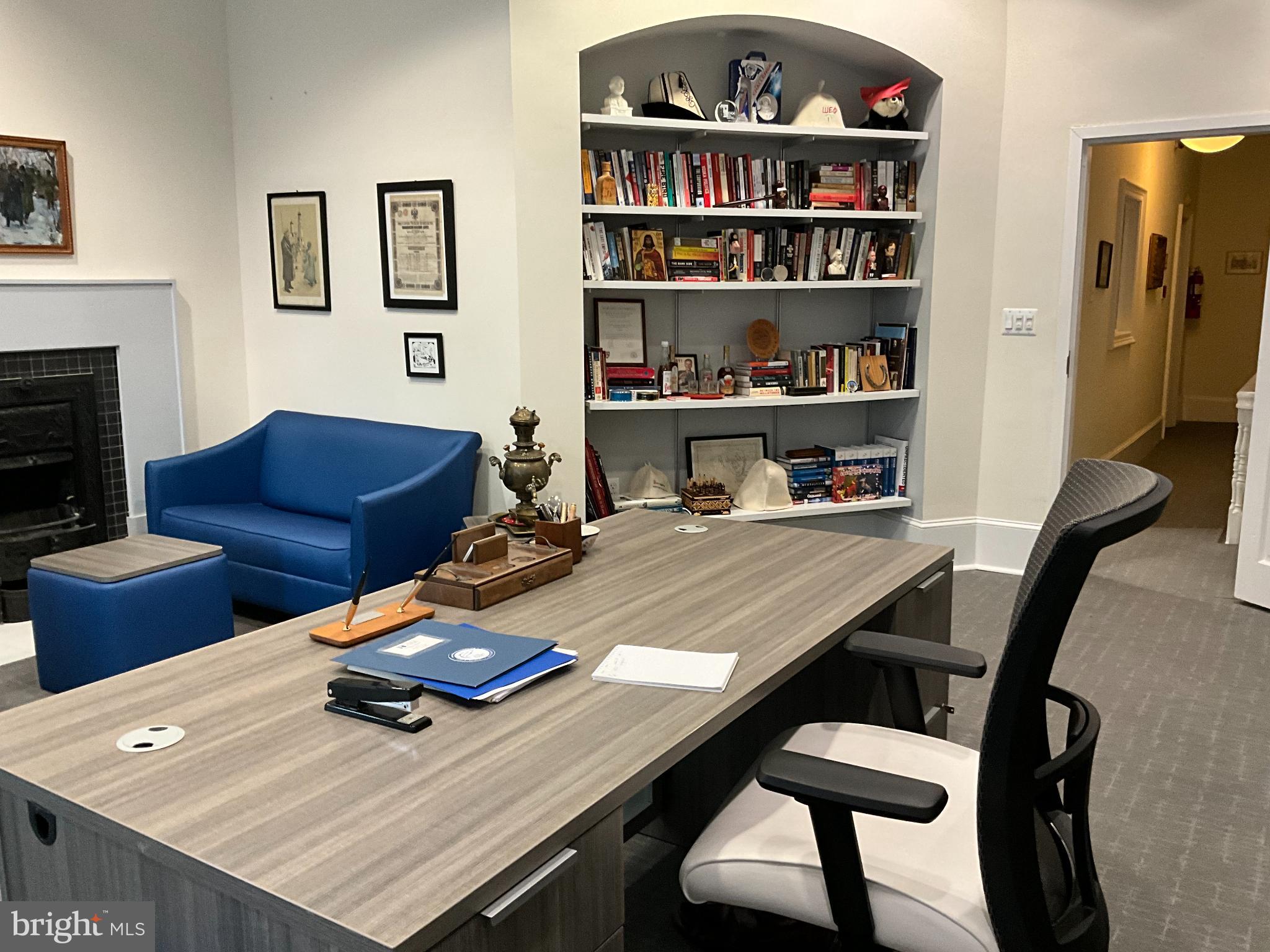 1230 17th Street Northwest Washington, DC 20036 - Photo 11 of 12 a view of a workspace with furniture and a bookshelf