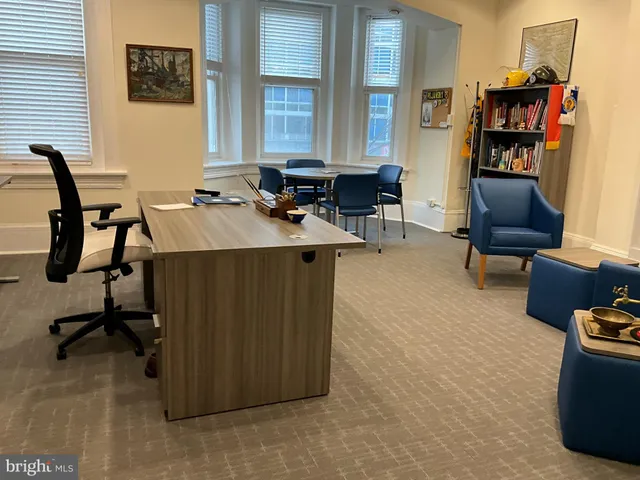 a view of a window and chair in a room