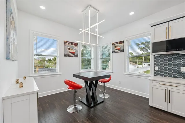a kitchen with a stove a sink and a refrigerator