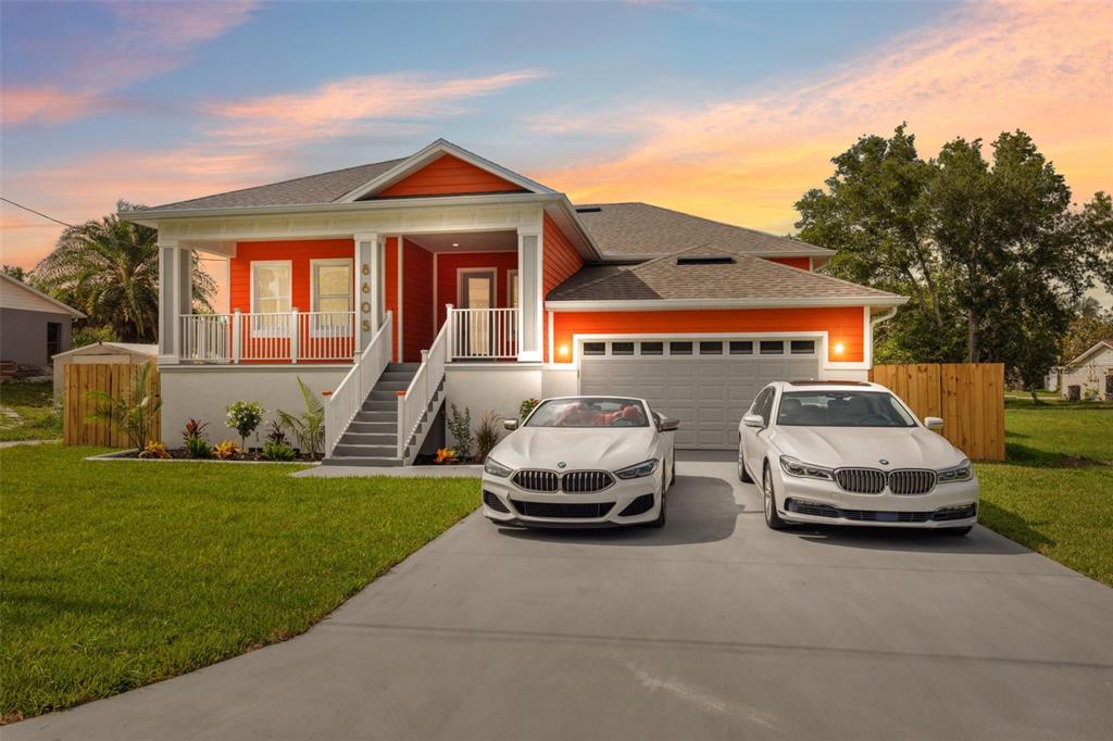 8605 Inwood Drive Hudson, FL 34667 - Photo 2 of 65 a car parked in front of a house