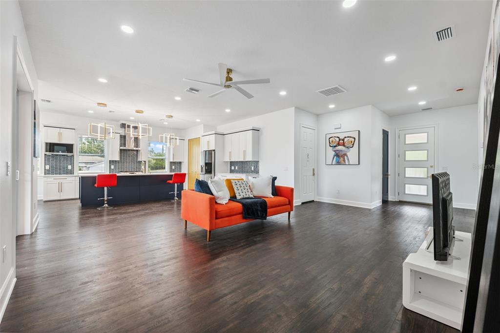 8605 Inwood Drive Hudson, FL 34667 - Photo 23 of 65 a living room with furniture and a wooden floor