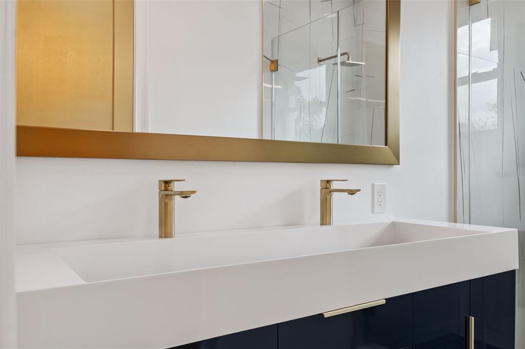 8605 Inwood Drive Hudson, FL 34667 - Photo 28 of 65 a bathroom with a sink and a mirror