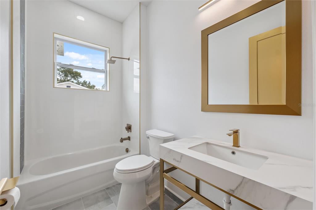 8605 Inwood Drive Hudson, FL 34667 - Photo 31 of 65 a bathroom with a sink a toilet and shower