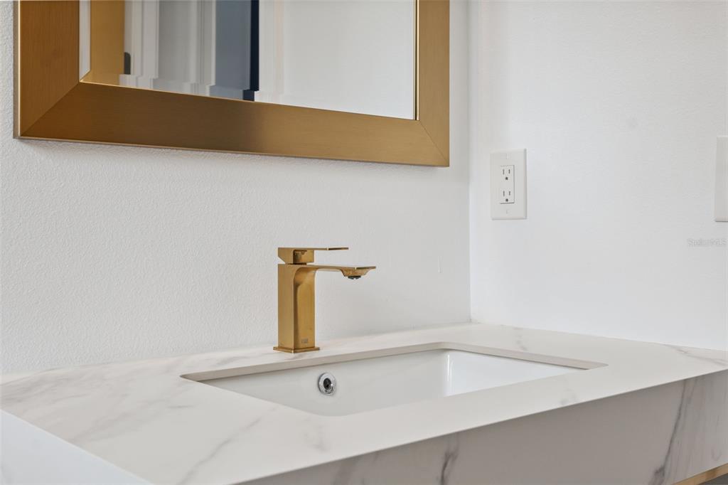 8605 Inwood Drive Hudson, FL 34667 - Photo 32 of 65 a close view of sink and tap