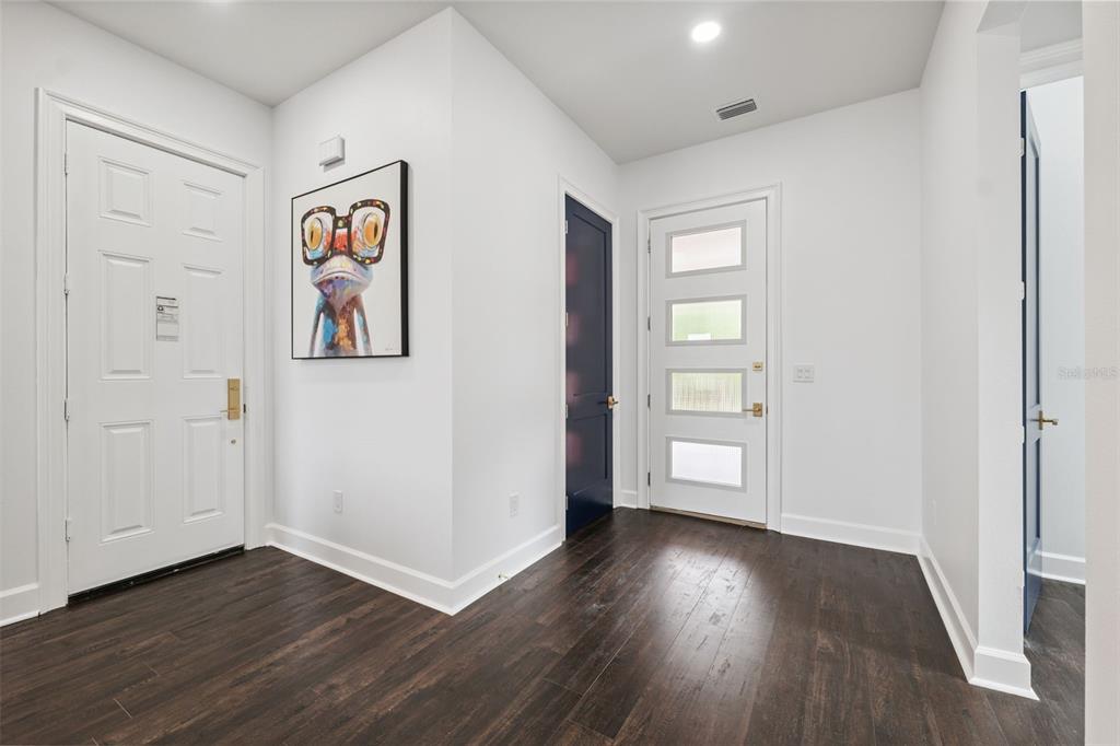 8605 Inwood Drive Hudson, FL 34667 - Photo 33 of 65 an empty room with wooden floor and closet