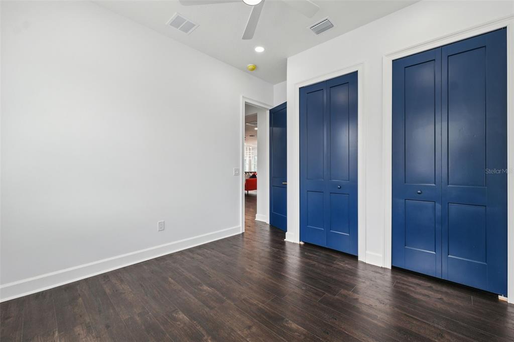 8605 Inwood Drive Hudson, FL 34667 - Photo 34 of 65 an empty room with wooden floor and closet area