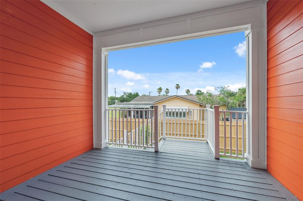 8605 Inwood Drive Hudson, FL 34667 - Photo 42 of 65 a view of a balcony with wooden floor