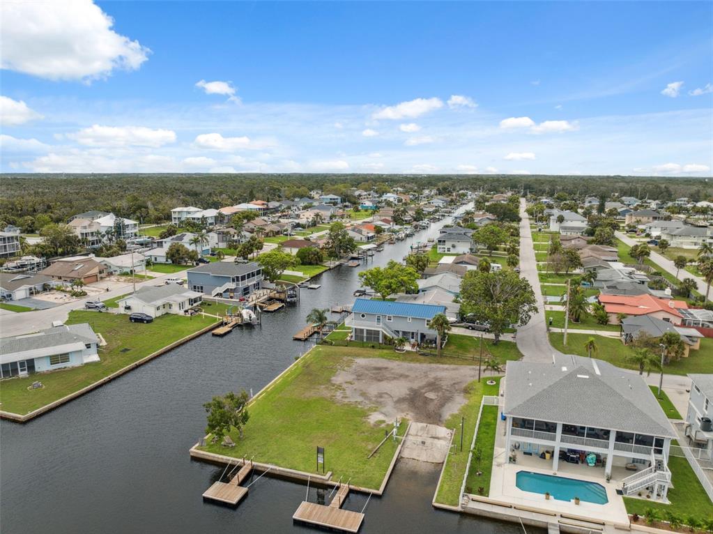 8605 Inwood Drive Hudson, FL 34667 - Photo 47 of 65 an aerial view of residential houses with outdoor space
