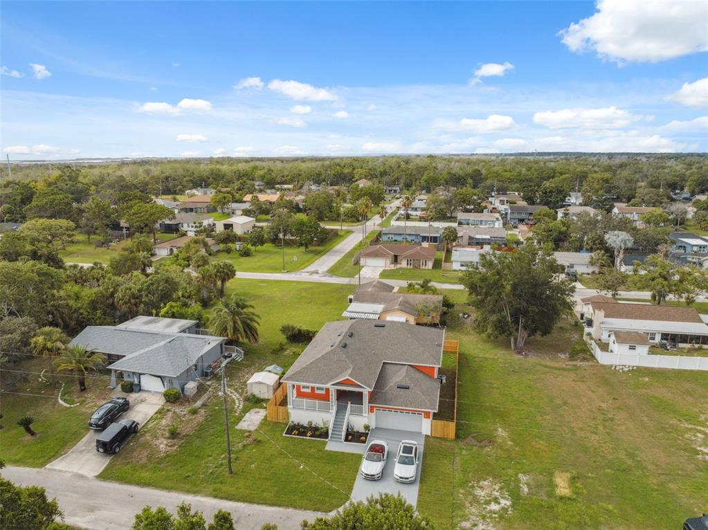 8605 Inwood Drive Hudson, FL 34667 - Photo 54 of 65 an aerial view of residential houses with outdoor space and swimming pool