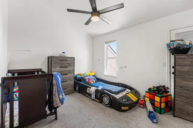 a view of a room with toys and a flat screen tv