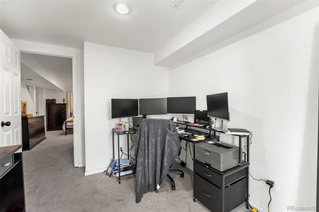 a view of a livingroom with a flat screen tv and furniture
