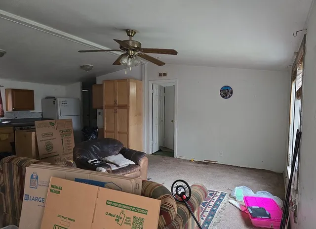a kitchen with a refrigerator and a sink