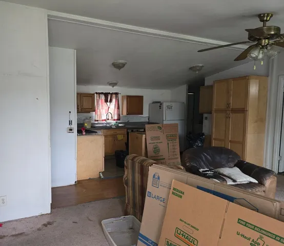 a kitchen with a refrigerator and a sink