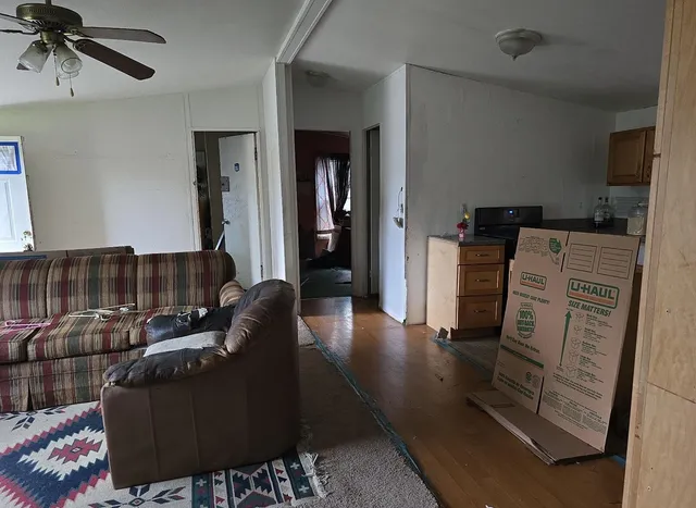a living room with furniture and a rug