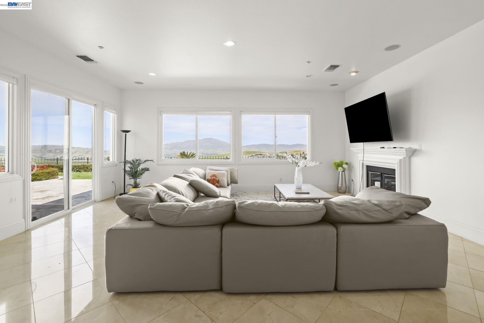 950 Winsford Court San Ramon, CA 94583 - Photo 19 of 68 a living room with fireplace furniture and a flat screen tv