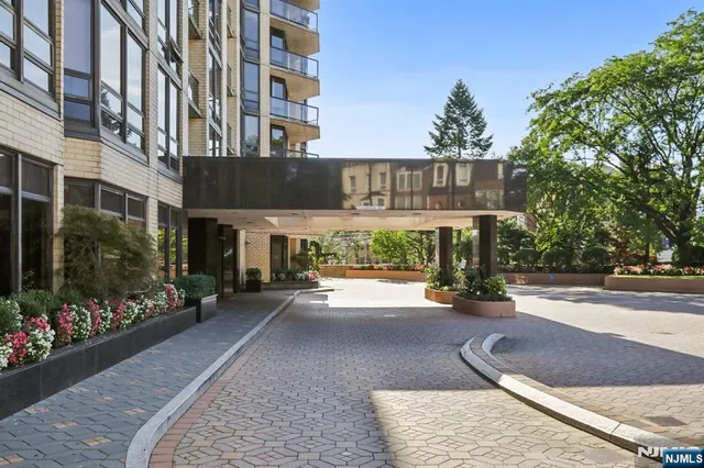 a view of a building with sitting area