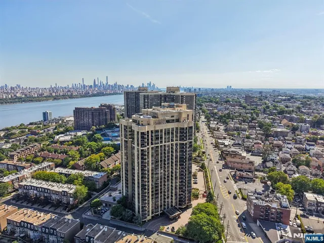 an aerial view of a house with a lake view