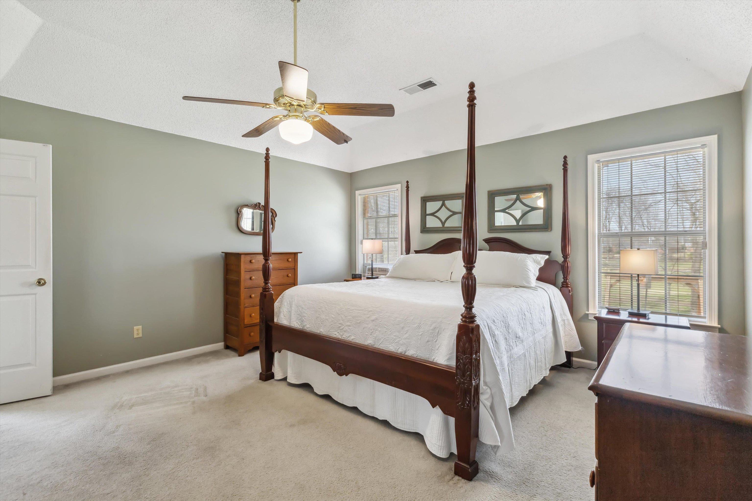 6302 Daybreak Drive Bartlett, TN 38135 - Photo 12 of 22 Carpeted bedroom featuring a ceiling fan, baseboards, and visible vents