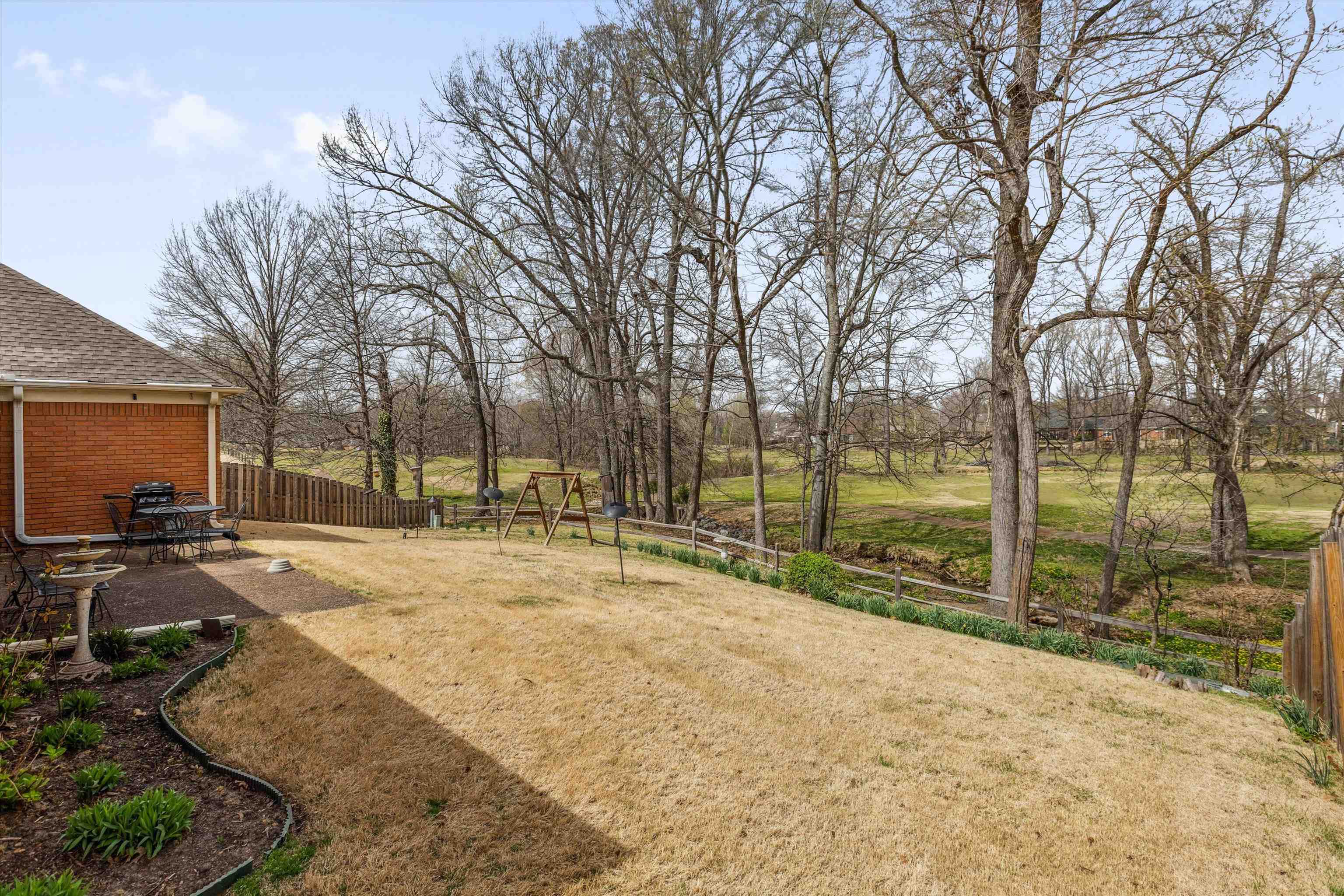 6302 Daybreak Drive Bartlett, TN 38135 - Photo 21 of 22 View of yard featuring a patio and fence