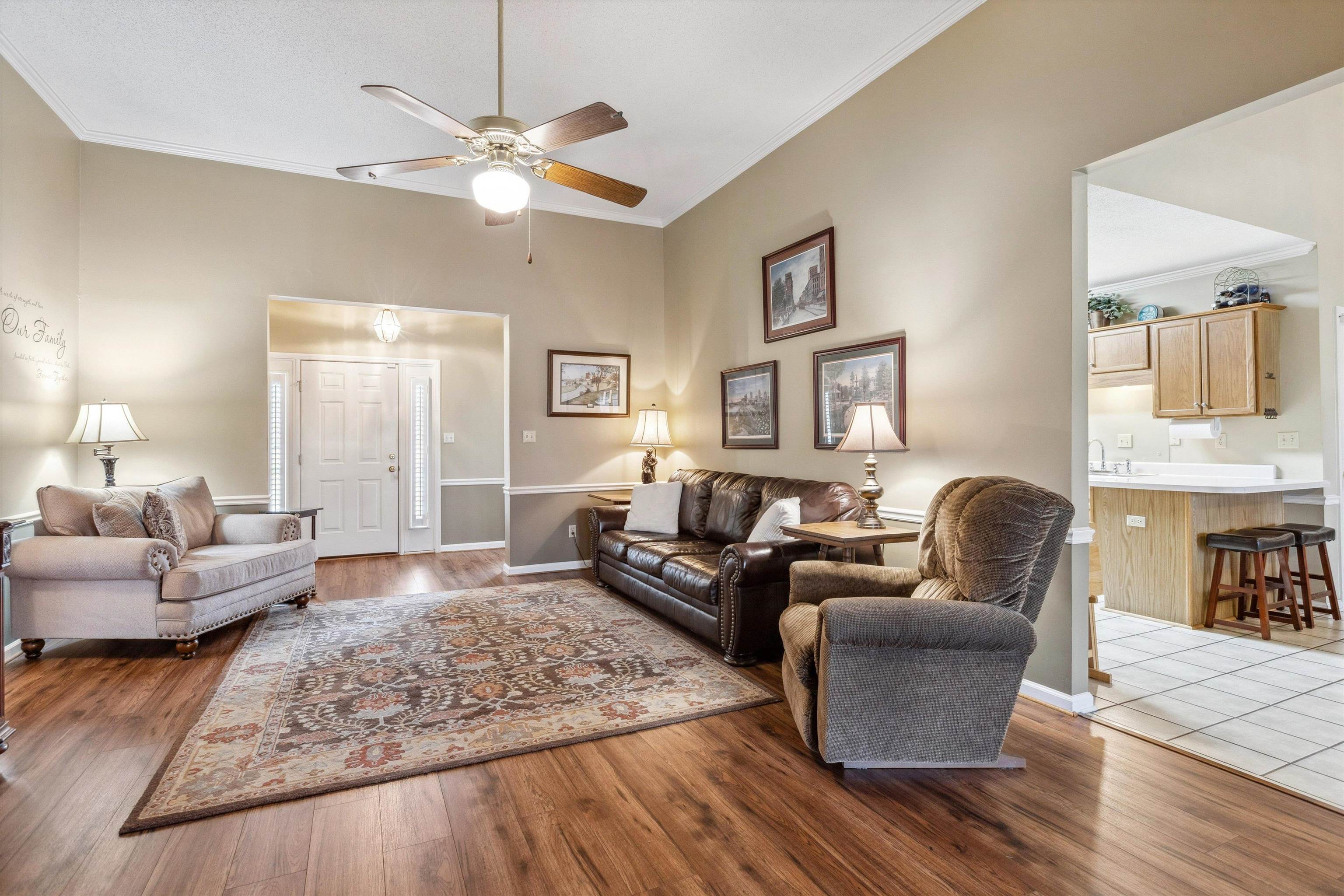 6302 Daybreak Drive Bartlett, TN 38135 - Photo 7 of 22 Living area with crown molding, a ceiling fan, and wood finished floors