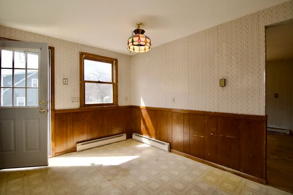 a view of an empty room with a window