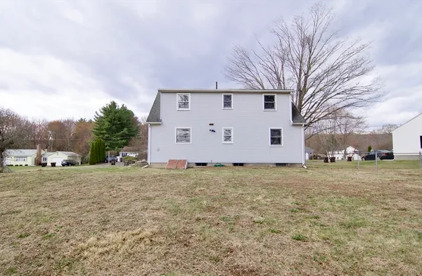 a view of a house with a yard