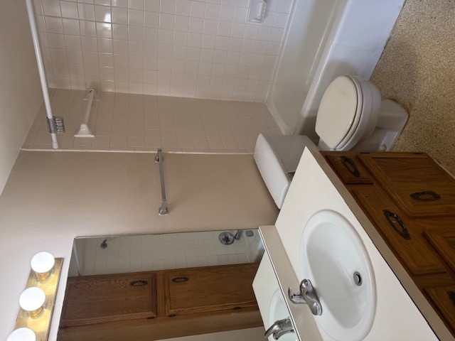 1401 West 29th Street, Unit C Austin, TX 78703 - Photo 11 of 19 a bathroom with a sink toilet and shower