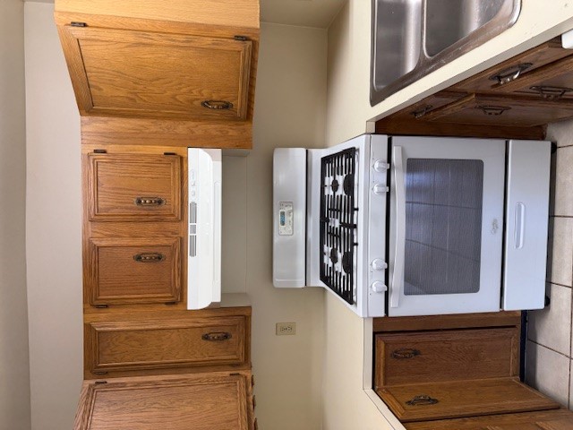 1401 West 29th Street, Unit C Austin, TX 78703 - Photo 5 of 19 a white stove top oven sitting inside of a kitchen