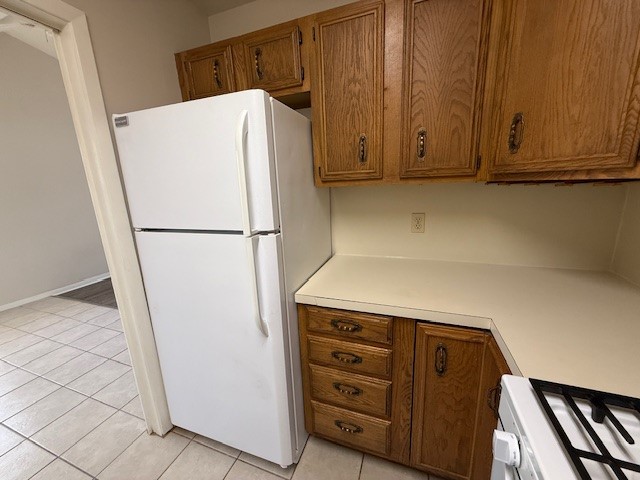 1401 West 29th Street, Unit C Austin, TX 78703 - Photo 6 of 19 a white refrigerator freezer sitting in a kitchen