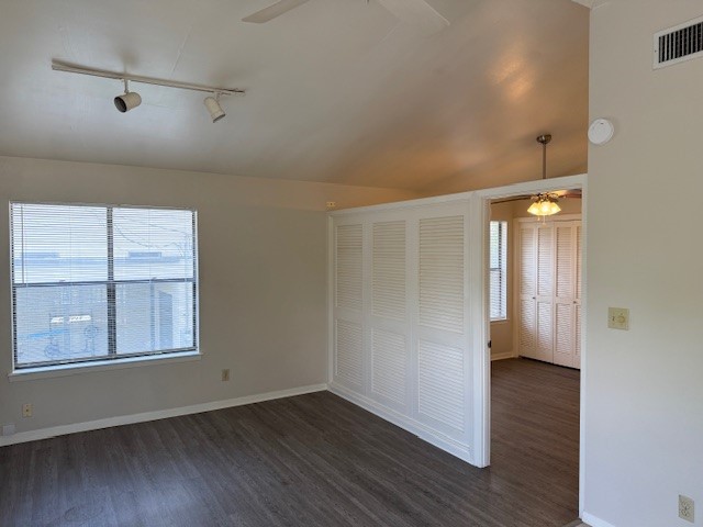 1401 West 29th Street, Unit C Austin, TX 78703 - Photo 8 of 19 an empty room with wooden floor and windows