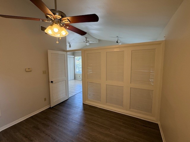 1401 West 29th Street, Unit C Austin, TX 78703 - Photo 10 of 19 an empty room with wooden floor fan and windows