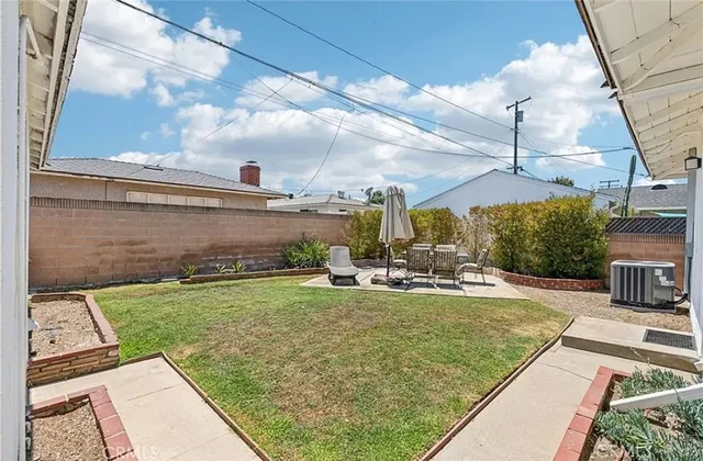 a view of a backyard with sitting area