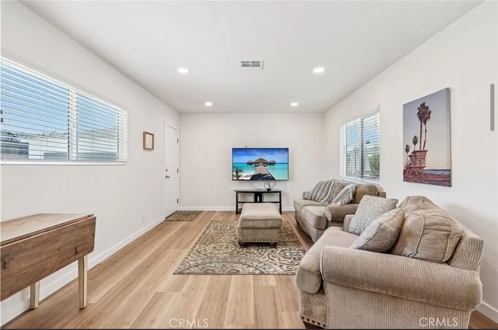 5340 East Mezzanine Way Long Beach, CA 90808 - Photo 5 of 18 a living room with furniture and a wooden floor