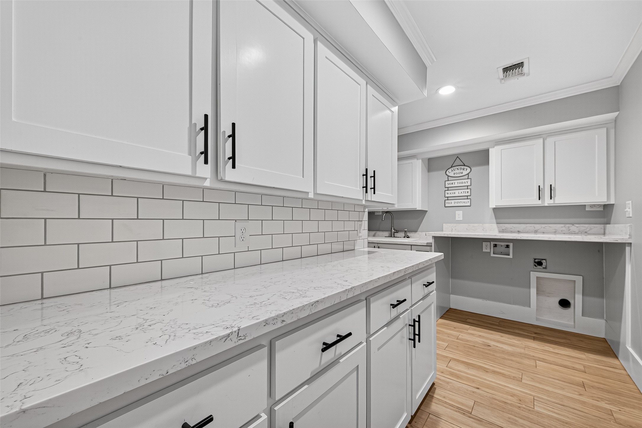 3115 Eula Morgan Road Katy, TX 77493 - Photo 29 of 36 a kitchen with a sink and cabinets
