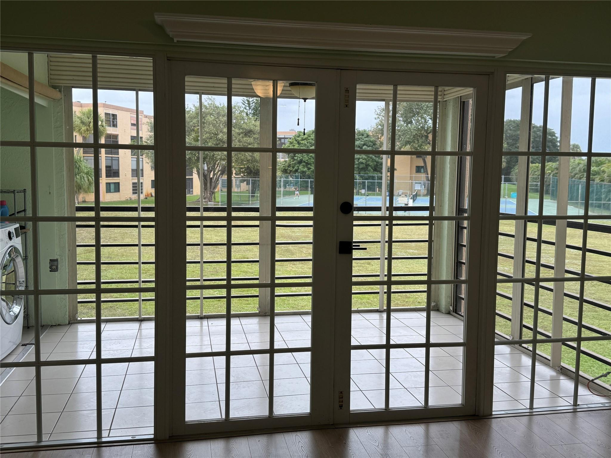 9300 Southwest 8th Street, Unit 215 Boca Raton, FL 33428 - Photo 15 of 43 FRENCH DOORS TO PATIO