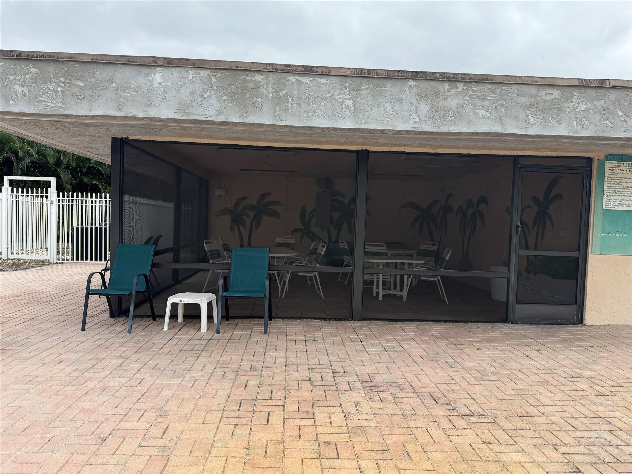 9300 Southwest 8th Street, Unit 215 Boca Raton, FL 33428 - Photo 8 of 43 SCREENED IN EATINGAREA OFF POOL