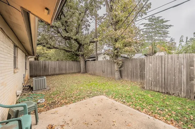 a backyard of a house with lots of green space