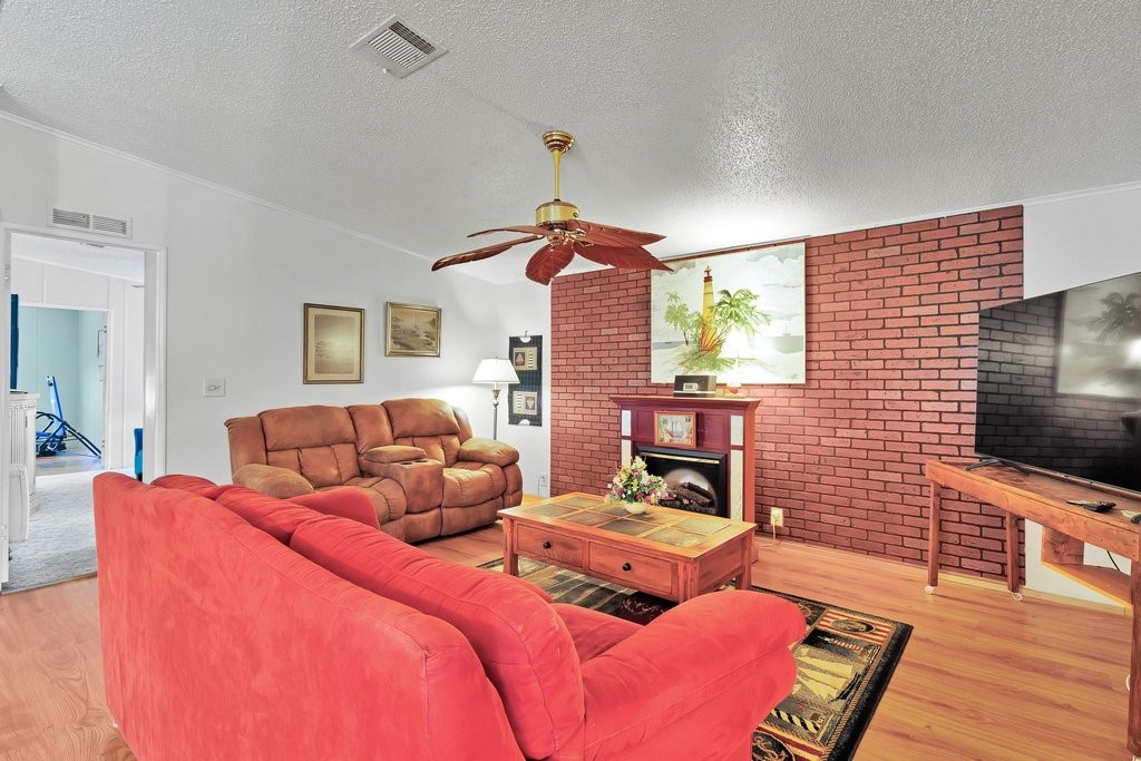 7605 Cedar Bark Road Sebastian, FL 32976 - Photo 5 of 34 a bedroom with a bed and wooden floor